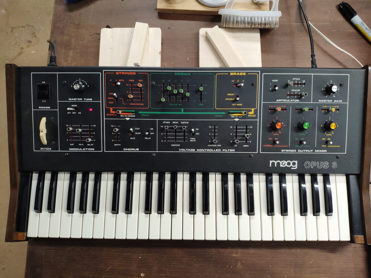 Moog Opus 3 ensemble synthesizer on the workbench